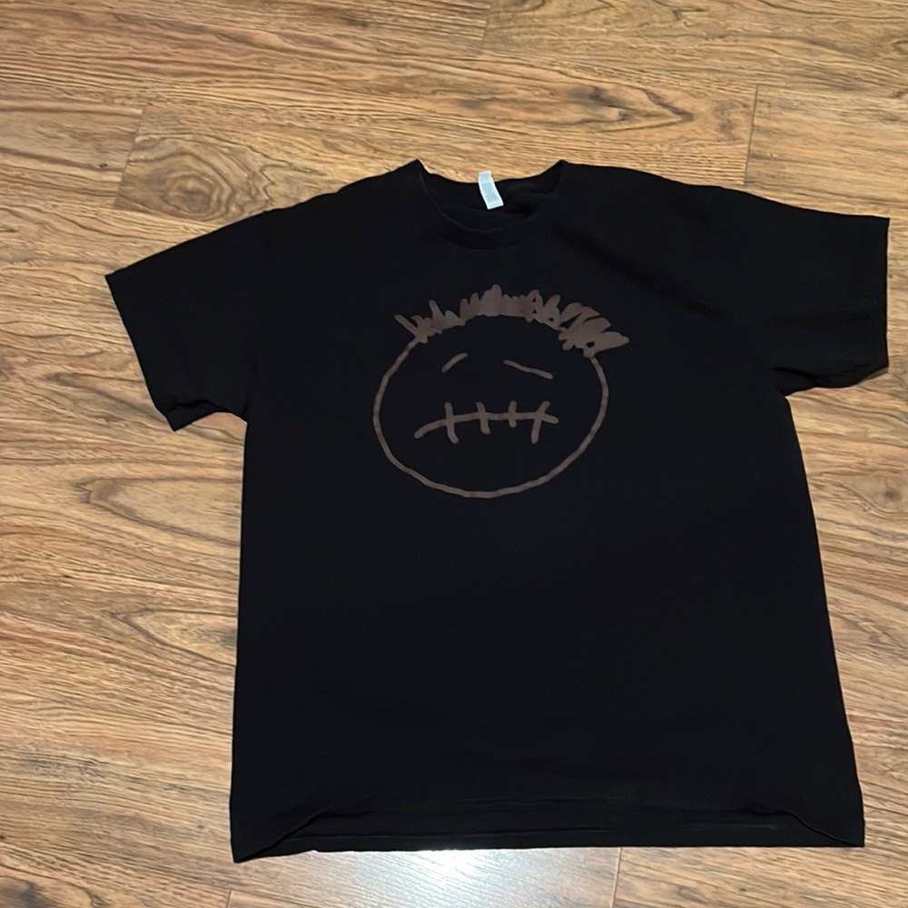 Men’s black T-shirt with face on it